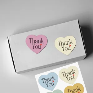 Heart-shaped macaron color thank you sealing stickers for envelope and gift packaging detail.