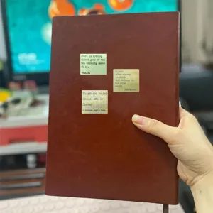 Detailed view of vintage English quote stickers on notebook, typewriter font literature design.