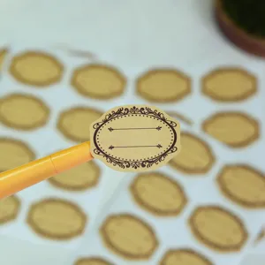 Closeup of blank kraft paper sticker with vintage border, ideal for handmade gifts and baking.