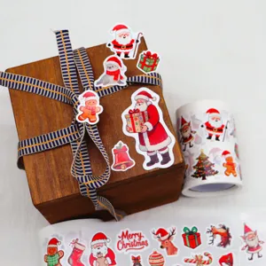 Detail view of Christmas sticker roll showing various festive patterns for holiday decor.