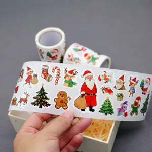 Christmas sticker roll detail showcasing cute Santa and reindeer festive decorative patterns.
