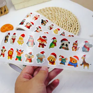 Christmas sticker roll detail view showing cute cartoon animal designs for holiday party decor.