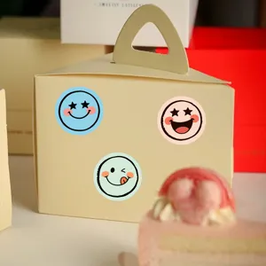 Detail shot of cute colorful smiley face stickers decorated on gift box, cartoon style.