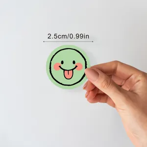 Round cartoon smiley face sticker detail shot showing 2.5cm size dimension clearly.