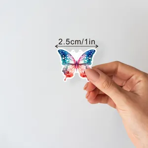 Close-up detail shot of colorful watercolor butterfly sticker, creative decorative label.