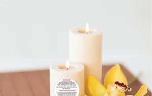Candle warning sticker with clear English safety instructions, detail view for candle safety.