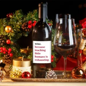 Funny teacher wine bottle label sticker with cute holiday themed festive decoration.