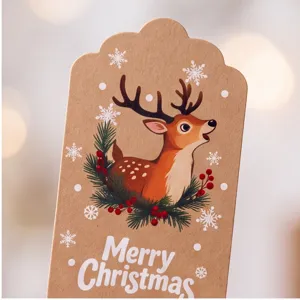 Kraft paper Christmas gift tag with cute cartoon reindeer and snow flake design for holiday packaging.