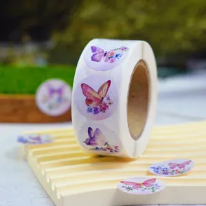 Detail view of rolled colorful butterfly floral stickers, perfect for gift packing and decor.