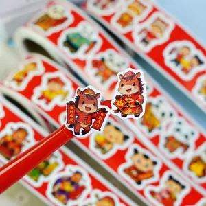 Close-up of Chinese New Year roll stickers, festive cartoon horse design for gift decoration.