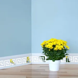 Detail shot of reflective acrylic mirror wall stickers with classic Greek key border design.