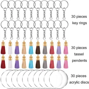 Acrylic keychain blanks with colorful leather tassels and metal rings for DIY craft projects.
