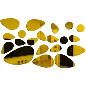 3D golden pebble mirror wall stickers detail shot, showing unique acrylic wall decor reflections.