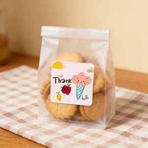Detail view of cute square Thank You sticker and frosted packaging bag, perfect for sealing gifts.