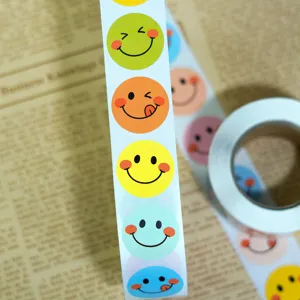 Colorful smiley face reward stickers roll detail view, perfect for gift box sealing and DIY crafts.