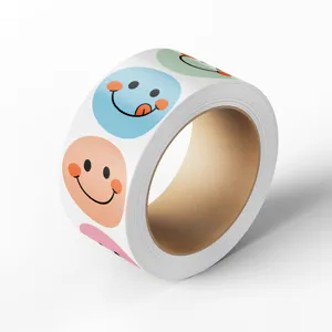 Colorful smiley face reward stickers roll for gift box sealing and DIY packaging crafts.