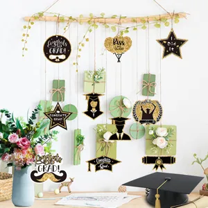Graduation party hanging decorations black and gold cardstock ornaments for school event decor.