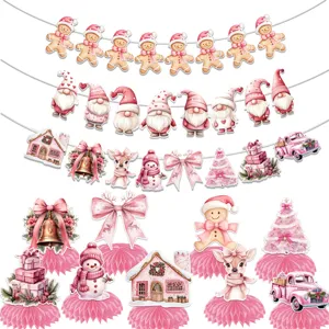 Pink Christmas party decorations with cute gingerbread man garlands and paper honeycomb centerpieces.