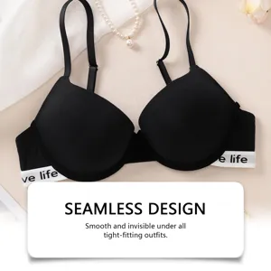 Detail shot of the black seamless wireless bra, featuring elastic band and smooth finish.