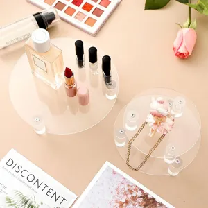 Transparent acrylic display stand for cosmetics, jewelry, and collectibles. Multi-tier design.