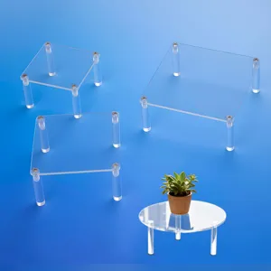 Clear acrylic display riser stand set for collectibles, figures, cupcakes, and retail items.