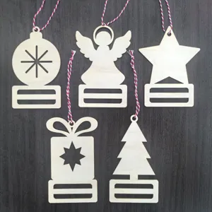 Detailed view of unfinished wooden Christmas ornaments set, laser cut holiday tree gift tags.