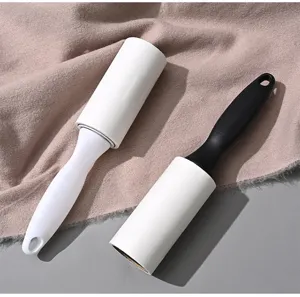 Portable lint roller with white and black handles, tearable sticky paper for pet hair.