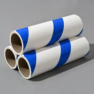 Sticky lint roller refill rolls with diagonal blue and white stripes for home cleaning.