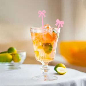 Acrylic pink bow cocktail stirrers for drinks, coffee, parties, weddings and beverage decor.