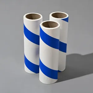 Close-up of blue and white diagonal tear lint roller refill cores, 3 rolls set for home cleaning.