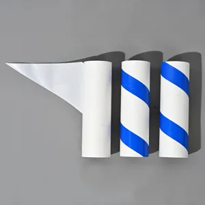 Detailed view of diagonal tear lint roller refill rolls, sticky dust sheets for household use.