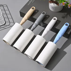 Portable lint roller with four colored handles for effortless pet hair and dust removal.