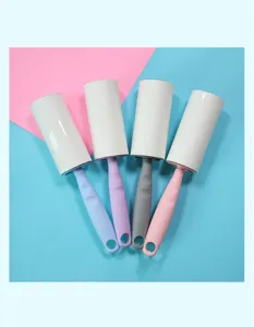 Close-up detail of colorful lint rollers with replacement rolls and ergonomic handles for cleaning.