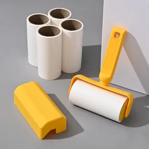 Lint roller for pet hair removal with yellow handle and four refill rolls for clothes cleaning.