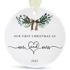 Wooden round Christmas tree hanging ornament with romantic couple design and festive wreath.