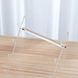Clear acrylic folding knife display rack detail, transparent desktop tool storage stand slot.