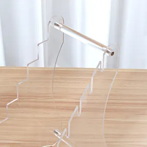 Clear acrylic desktop display stand detail view, perfect for organizing knives and small items.