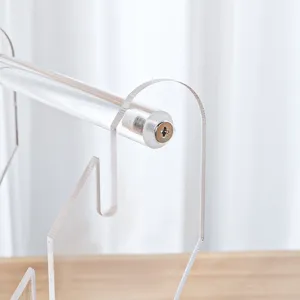 Acrylic knife display stand detail showing clear material and secure metal screw fasteners.