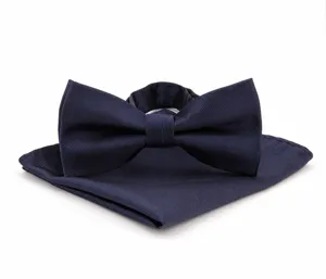 Navy blue bow tie and pocket square set detailed view featuring elegant fine twill fabric texture.
