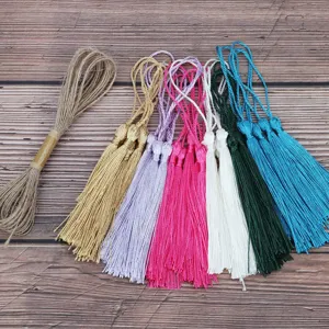 Colorful tassel and jute twine details, perfect for DIY wooden bookmarks and craft decorations.