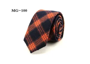 Detail view of the stylish men's British plaid necktie in navy and orange colors.
