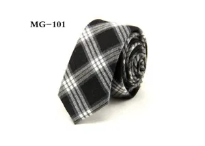 Detail shot of men's black and white plaid tie showing fabric texture and rolled shape.