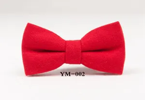 Red wool bow tie detail shot, showing the delicate fabric texture and classic shape.