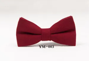 Close-up detail shot of the elegant burgundy wool bow tie, highlighting the fine texture.