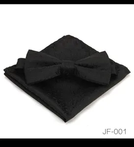 Détail de tissu de nœud papillon et pochette jacquard noir, mode de mariage formel élégant.