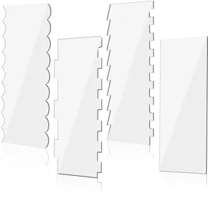 Clear acrylic cake scraper detail, featuring various tooth shapes and smooth edges.