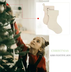 Wooden Christmas stocking cutouts detail scene, unfinished DIY tree ornament crafting display.