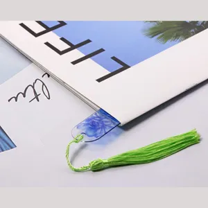 Transparent acrylic bookmark with green tassel, beautiful floral design, perfect for reading books.