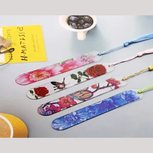 Transparent acrylic bookmarks with colorful tassels, floral and butterfly designs for reading.