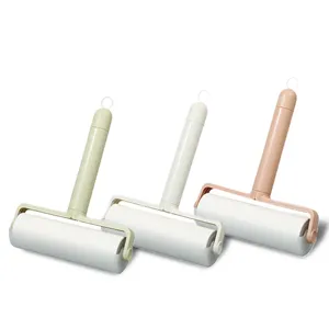 Lint roller for pet hair removal with sticky paper refills, portable clothes cleaner brush.